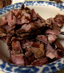 Meat picked off the bones ready to be divided between containers of broth.