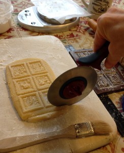 A sharp pizza wheel aides in getting clean crisp lines in cutting apart your Springerle.