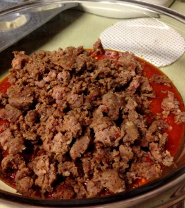Add your cooked and drained meat to the marinara in a large bowl.