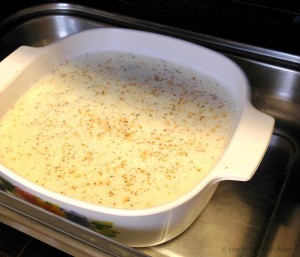 Place baking dish with custard mixture in empty roasting pan.